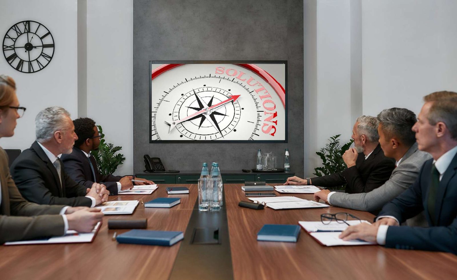 Group of multicultural business people having video conference while sitting in the meeting room. Business team looking at screen. Business meeting. Teamwork. Office life